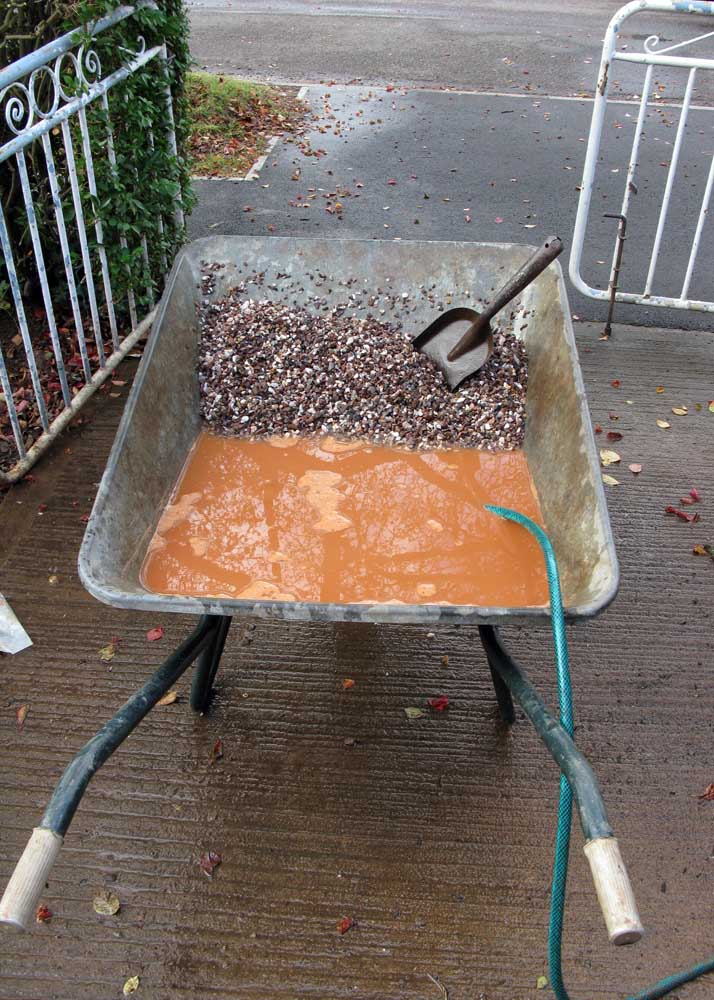 Red Westcountry sand washing out of the shingle